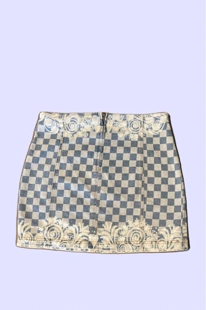 A high-waisted, beige and black checkered hand bleached mini skirt with a quarter zip back closure.