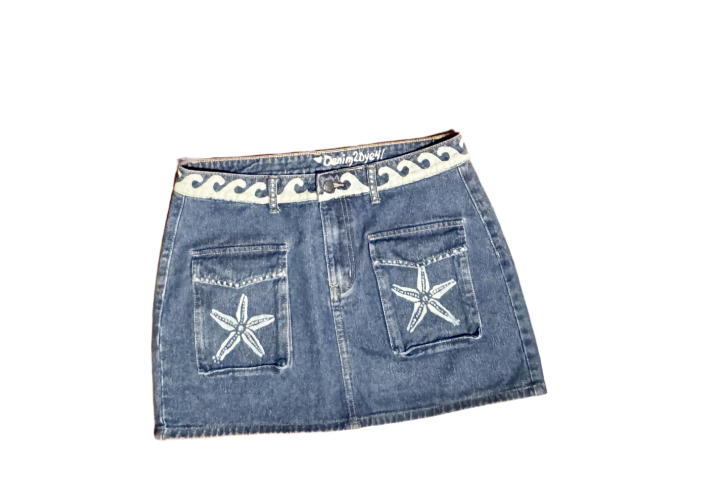 "Hand-bleached denim mini skirt with cargo pockets, starfish and wave design – size 10 one-of-a-kind"