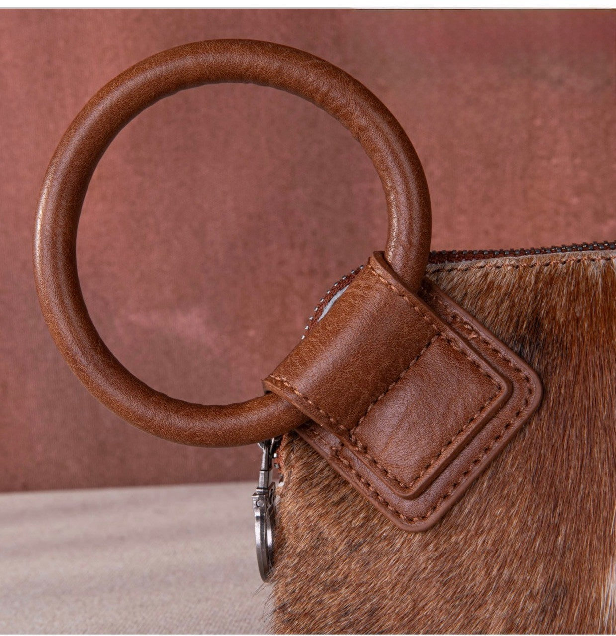 • wild-west-cowhide-wristlet-brown-front