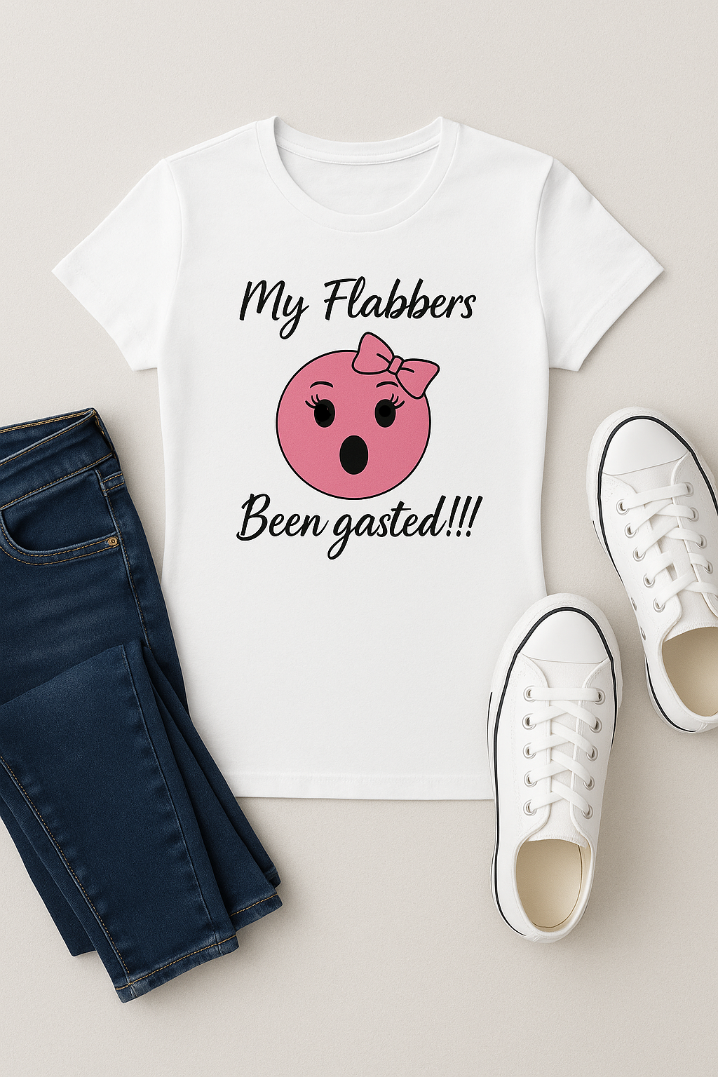 Not Exact Representation my-flabbers-been-gasted-graphic-pink-emoji-t-shirt-fundraiser-for-tourette-association-of-america-lashes front white tee with tennis shoes and blue jeans