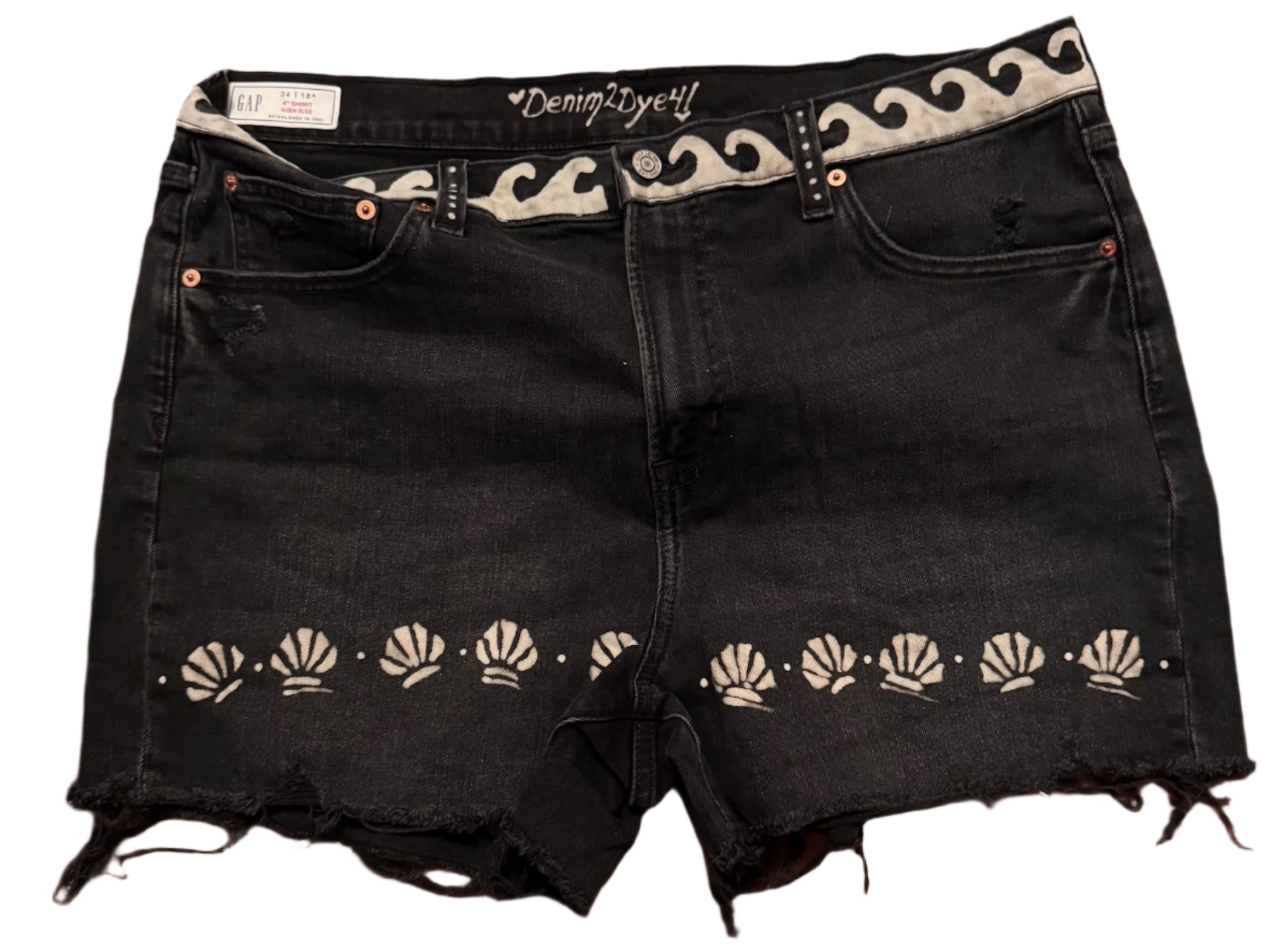 Black GAP hand-bleached 4-inch denim shorts with wave waist, mini shell at hemline, back waist wording “Sand, Relax, Sun and Repeat,” sun, shells and sandals on pockets