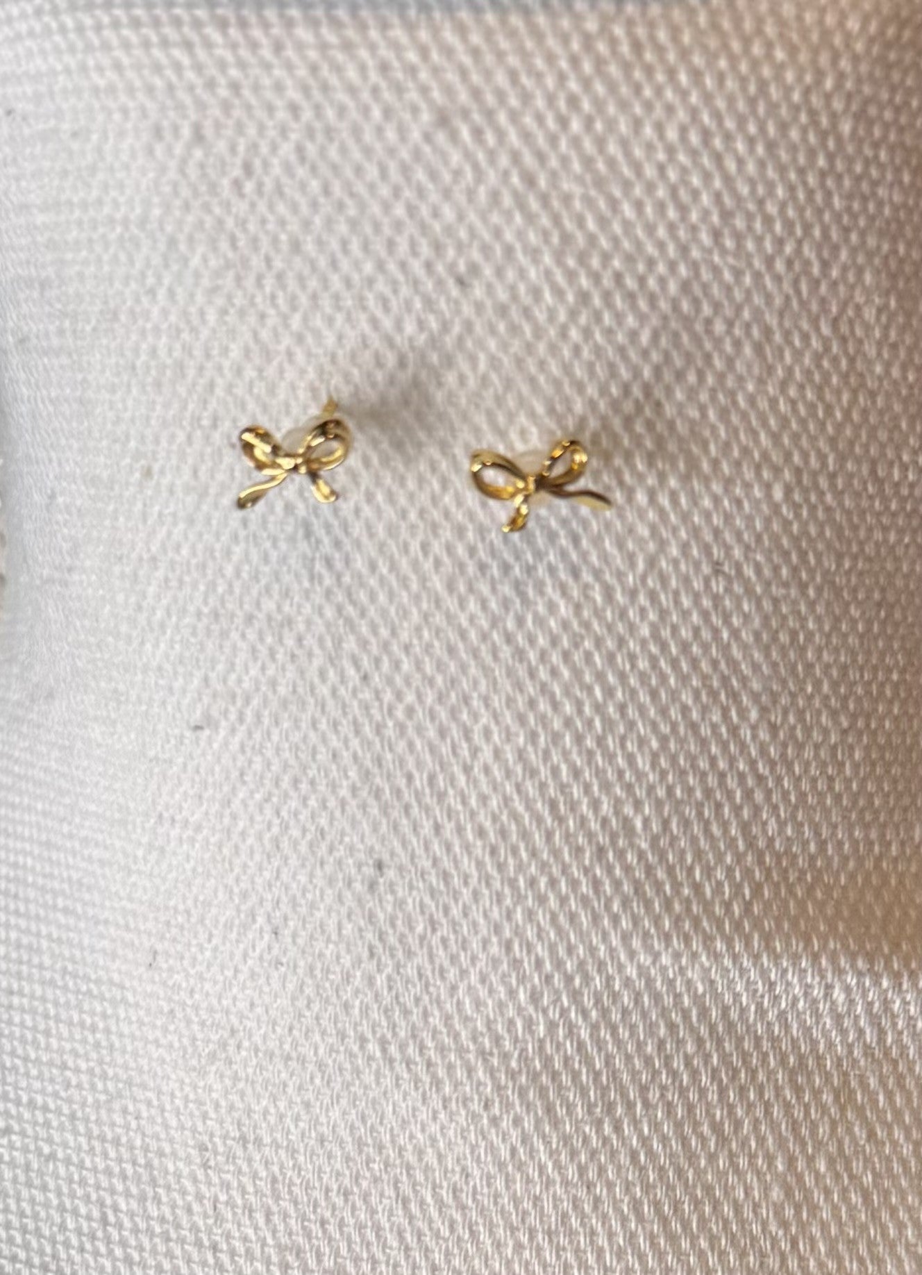 Dainty brass bow stud earrings in gold or silver with silicone backs – hypoallergenic, lightweight, and perfect for gifting