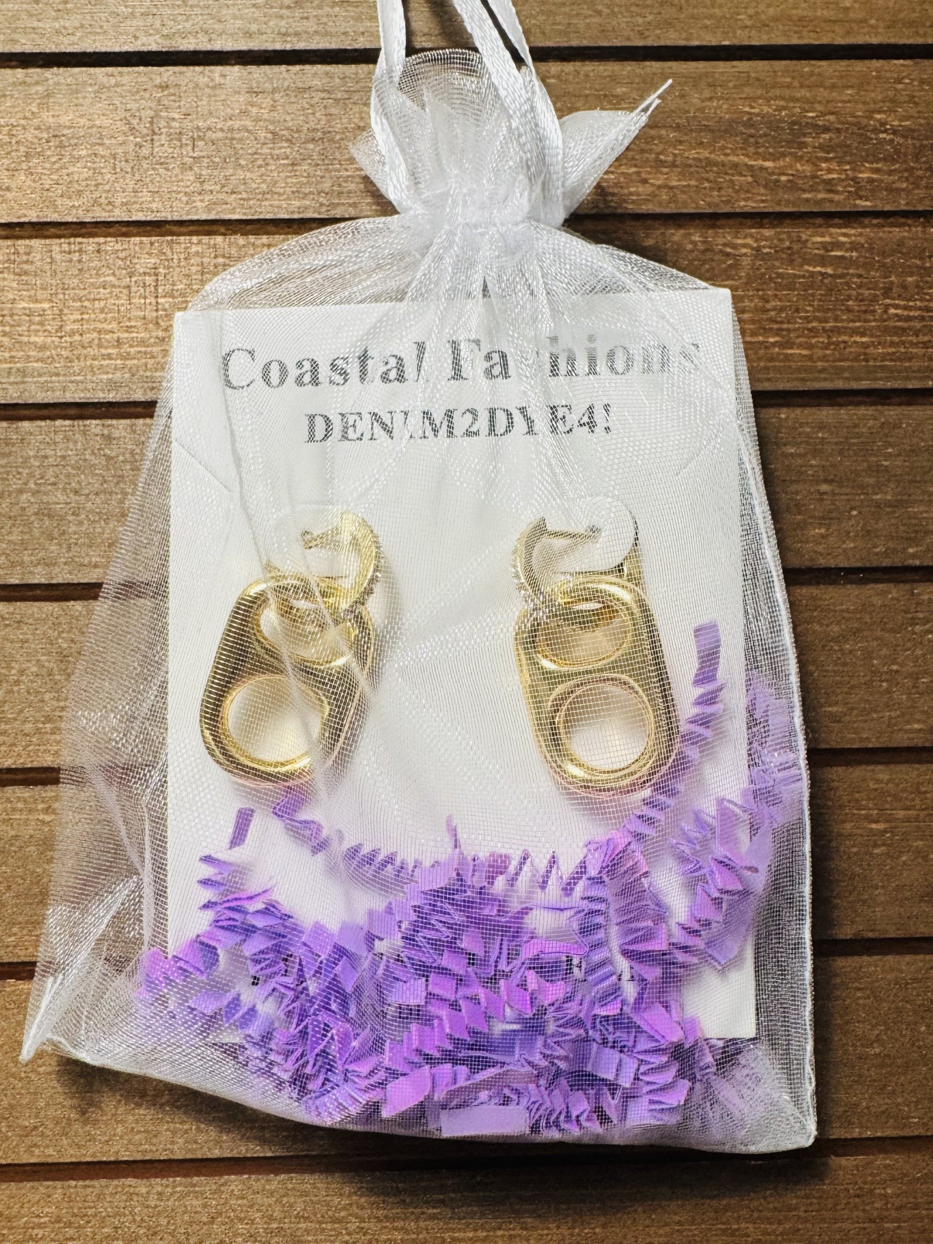 sun kissed gold pop tab charm in jewelry bag packaging