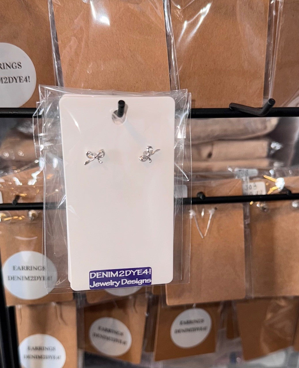 Dainty brass bow stud earrings in gold or silver with silicone backs – hypoallergenic, lightweight, and perfect for gifting