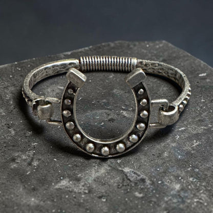 Silver horseshoe embellished open cuff bangle with black accents