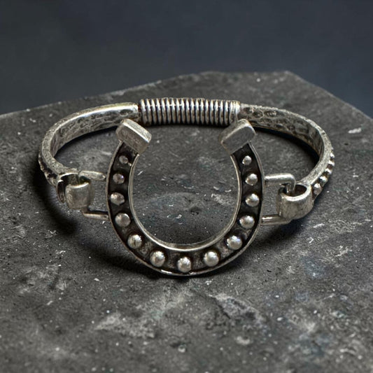 Silver horseshoe embellished open cuff bangle with black accents