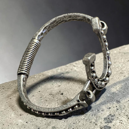 Silver horseshoe embellished open cuff bangle with black accents SIDE VIEW