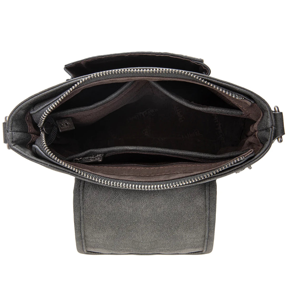 Trinity Creek floral tooled cowhide bag with studded crossbody strap inside. 
