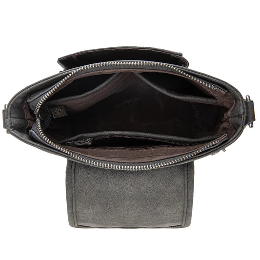 Trinity Creek floral tooled cowhide bag with studded crossbody strap inside. 