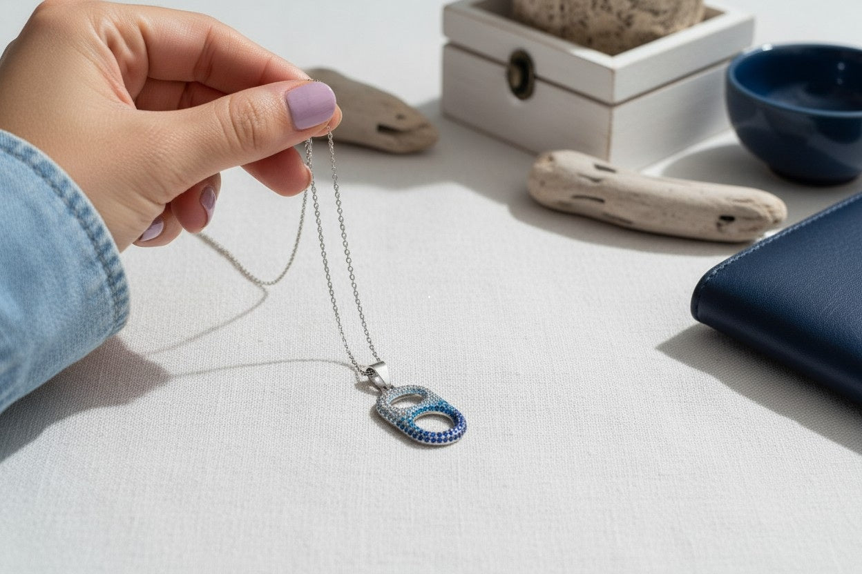 woman holding coastal wave necklace silver
