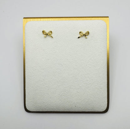 Dainty brass bow stud earrings in gold or silver with silicone backs – hypoallergenic, lightweight, and perfect for gifting