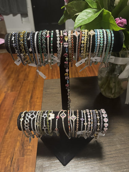 Assorted crystal bracelets in colorful rhinestone designs and metallic finishes.