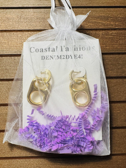sun kissed gold pop tab charm in jewelry bag packaging
