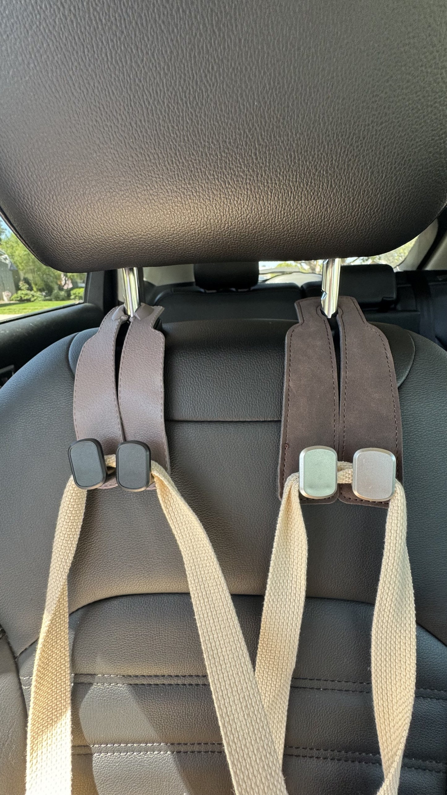 Gray The Purse Perch™ luxury car organizer holding a tote bag leather and suede poly. also holds phone for entertainment viewing for back seat passengers. 