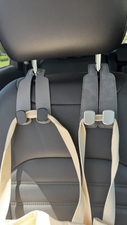 Grey The Purse Perch™ luxury car organizer holding a tote bag.