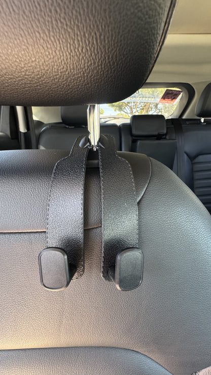 Black The Purse Perch™ multifunction headrest hook with aluminum alloy frame.