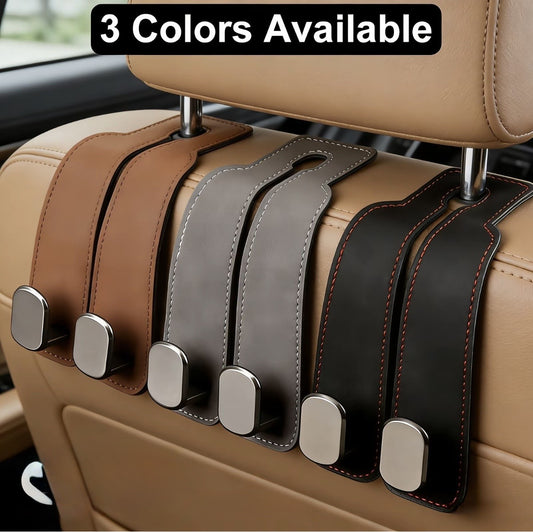 The Purse Perch™ leather car headrest hook holding a handbag in a luxury vehicle interior. Three colors, brown, grey and black. 